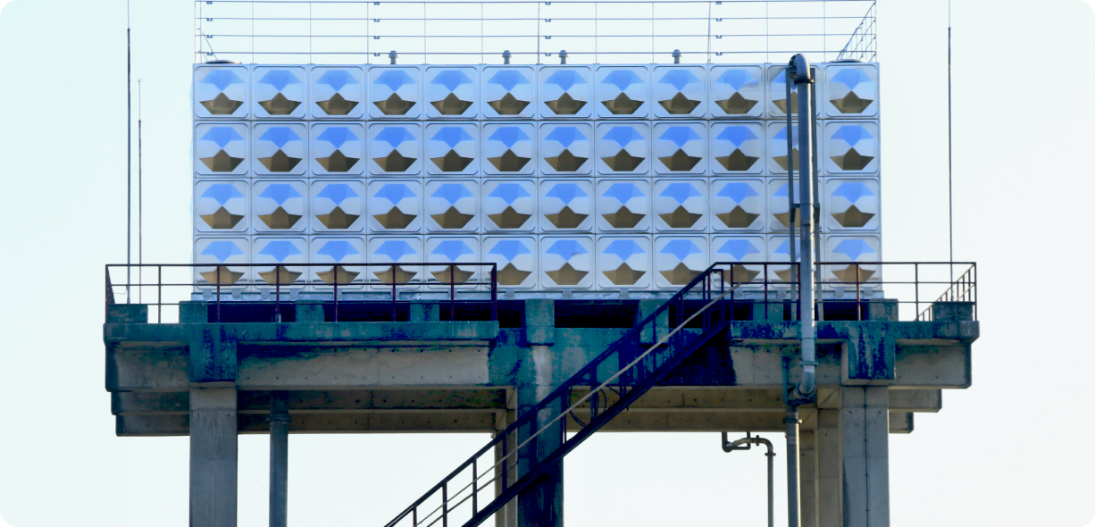 An image showing high-rise stainless steel water storage tanks